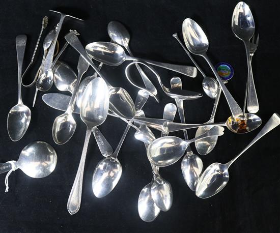 A small quantity of assorted Georgian and later teaspoons and other flatware including a Georgian silver caddy spoon